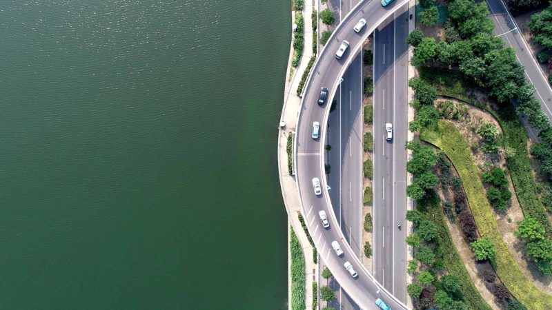 (190627) -- TIANJIN, June 27, 2019 (Xinhua) -- Aerial photo taken on June 26, 2019 shows vehicles running on an overpass by the Haihe River in north China's Tianjin. Haihe, known as the city's "mother river", runs for more than 70 km from Tianjin Municipality to Dagukou where it empties into the Bohai Sea. Nowadays nearly 30 bridges span across Haihe and many skyscrapers stand by the river. Haihe has become a major landscape belt in Tianjin, with its clear water and beautiful view along the bank. (Xinhua/Yue Yuewei)