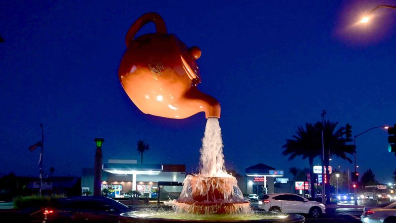 Water flows from the Soaring Teapot sculpture in Temple City, California on August 13, 2019. - China is the world's largest producer of tea, another item among a number of products expected to get hit after the US slaps $300 billion of tariffs on Chinese imports in September. (Photo by Frederic J. BROWN / AFP)