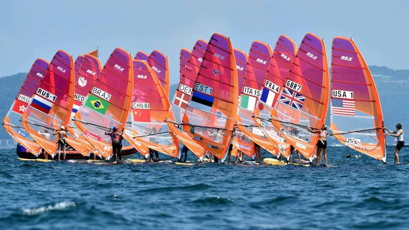 Windsurfers wait for the start the women's windsurfing RS:X class competition during a sailing test event for the Tokyo 2020 Olympic Games, off the coast Enoshima in Kanagawa Prefecture, on August 20, 2019. (Photo by Kazuhiro NOGI / AFP)