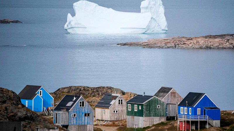 TOPSHOT - Icebergs float behind the town of Kulusuk in Greenland on August 19, 2019. - Denmark's prime minister said on August, 21, 2019 she was "annoyed and surprised" that US President Donald Trump postponed a visit after her government said its territory Greenland was not for sale, but insisted their ties remained strong. AFP/RSS.