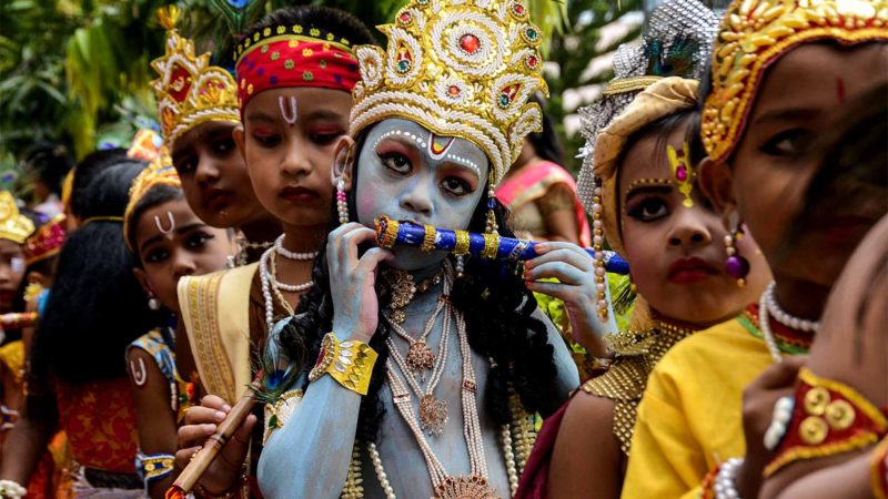 Schoolchildren dressed up as the Hindu deity Krishna wait to participate in a competition to celebrate 'Janmasthami,' marking the birth anniversary of Krishna, at their school in Agartala, Tripura, on August 23, 2019. (Photo by Arindam DEY / AFP)