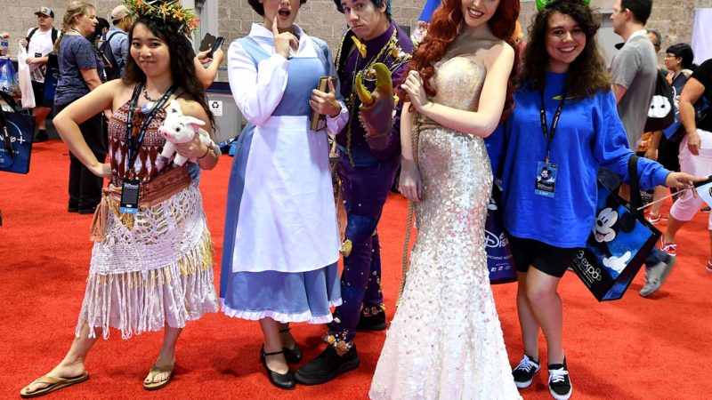 Cosplayers visit the D23 Expo, billed as the "largest Disney fan event in the world," August 23, 2019 at the Anaheim Convention Center in Anaheim, California. - Disney Plus will launch on November 12 and will compete with out streaming services such as Netflix, Amazon, HBO Now and soon Apple TV Plus. (Photo by Robyn Beck / AFP)