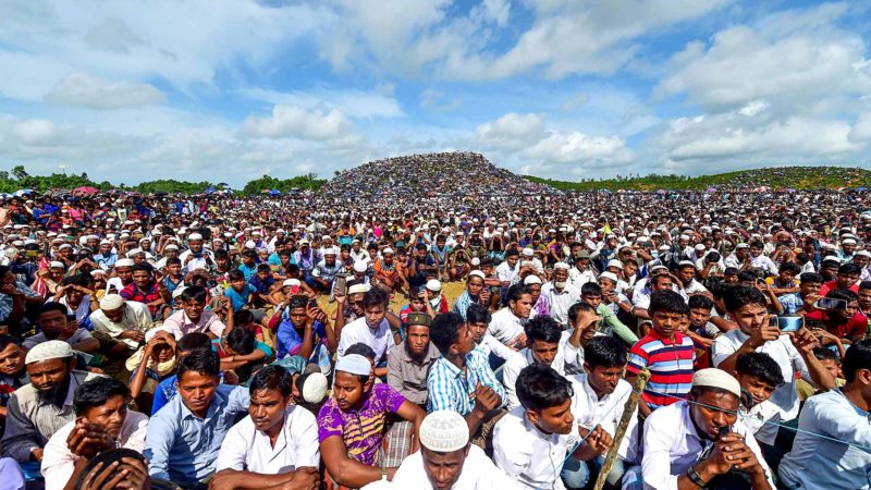 Rohingya refugees attend a ceremony organised to remember the second anniversary of a military crackdown that prompted a massive exodus of people from Myanmar to Bangladesh, at the Kutupalong refugee camp in Ukhia on August 25, 2019. - Some 200,000 Rohingya rallied in a Bangladesh refugee camp on August 25 to mark two years since they fled a violent crackdown by Myanmar forces, just days after a second failed attempt to repatriate the refugees. (Photo by MUNIR UZ ZAMAN / AFP)