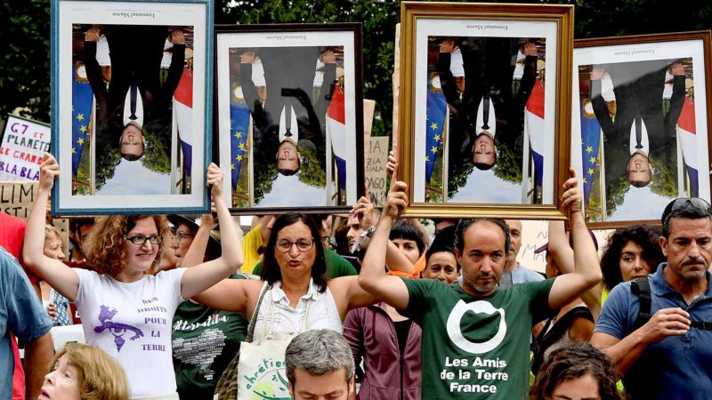 Protestors hold inverted portraits of French President Emmanuel Macron as they march in Bayonne, south-western France on August 25, 2019, on the second day of the annual G7 Summit attended by the leaders of the world's seven richest democracies, Britain, Canada, France, Germany, Italy, Japan and the United States. AFP/RSS.