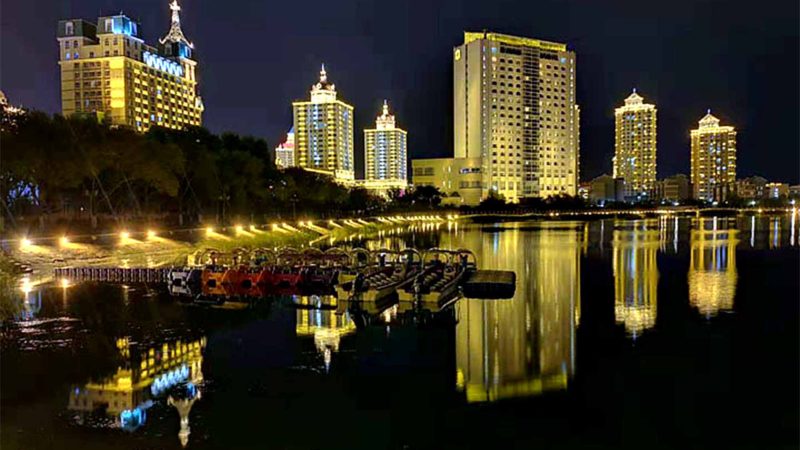 MANZHOULI -- Buildings are illuminated with energy efficient architectural LED lighting in Manzhouli, north China's Inner Mongolia Autonomous Region, Aug. 27, 2019. Xinhua/RSS.