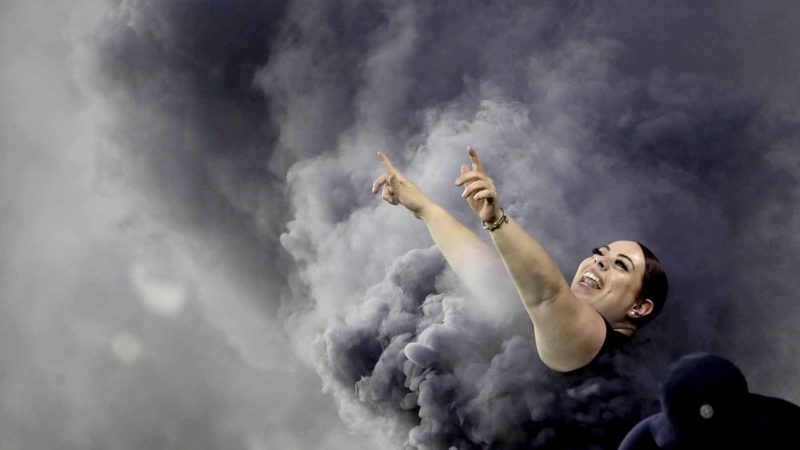 A Los Angeles FC fan cheers during the first half of the team's MLS soccer match against the San Jose Earthquakes on Wednesday, Aug. 21, 2019, in Los Angeles. (AP Photo/Marcio Jose Sanchez)