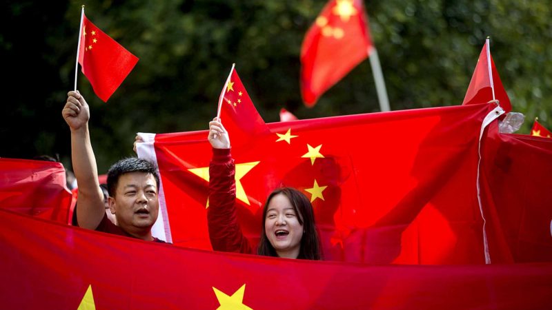 Pro-China counter-protesters wave flags and shout at Hong Kong anti-extradition bill protesters during opposing rallies in Vancouver, British Columbia, on Saturday, Aug. 17, 2019. (Darryl Dyck/The Canadian Press via AP)