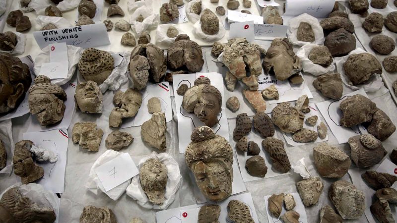 In this Saturday, Aug. 17, 2019 photo, small statues damaged by the Taliban are laid out on a table for restoration at the National Museum of Afghanistan, in Kabul, Afghanistan. Taliban fighters armed with hammers 18 years ago shattered ancient Buddha figurines because they were judged to be against Islam. (AP Photo/Rafiq Maqbool)