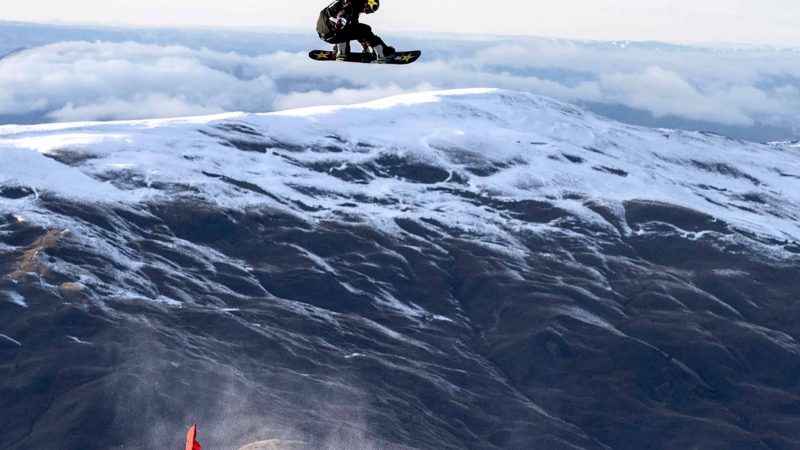 United Sates Chris Corning performs in the final of the mens FIS Snowboard World Cup Big Air during the Winter Games at the Cardrona ski field near Wanaka, New Zealand, Saturday, Aug. 24, 2019. (Iain McGregor/WinterGames via AP)