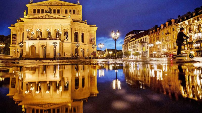 A Chinese tourist drives an E-scooter over the square in front of the Old Opera in Frankfurt, Germany, on a rainy Monday, Sept. 30, 2019. AP/RSS