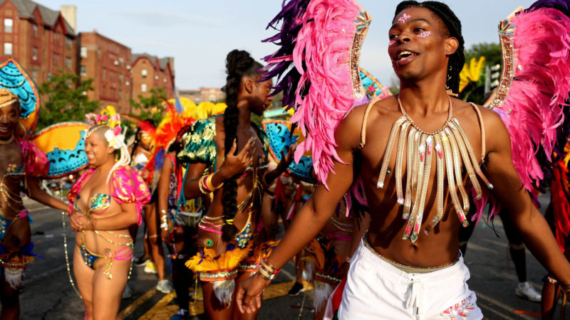 NEW YORK, NY - SEPTEMBER 02: Parade-goers walk in the annual West Indian Day Parade on September 02, 2019 in the Brooklyn borough of New York City. The annual celebration of Caribbean culture is one of the largest of its kind and features dozens of floats and costumed participants that make their way down Flatbush Avenue.   Photo/RSS