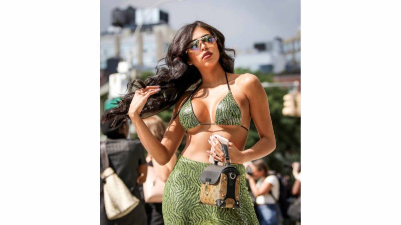 NEW YORK, NEW YORK : A guest is seen wearing green sequent outfit with brown Louis Vuitton bag during New York Fashion Week.   AFP /RSS.