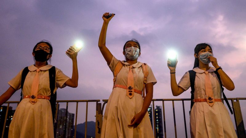 CORRECTION - Students take part in a human chain event at Sand Martin Bridge in Sha Tin district in Hong Kong on September 19, 2019. (Photo by Philip FONG / AFP) / “The erroneous mention[s] appearing in the metadata of this photo by Philip FONG has been modified in AFP systems in the following manner: [September 19] instead of [September 29]. Please immediately remove the erroneous mention[s] from all your online services and delete it (them) from your servers. If you have been authorized by AFP to distribute it (them) to third parties, please ensure that the same actions are carried out by them. Failure to promptly comply with these instructions will entail liability on your part for any continued or post notification usage. Therefore we thank you very much for all your attention and prompt action. We are sorry for the inconvenience this notification may cause and remain at your disposal for any further information you may require.”