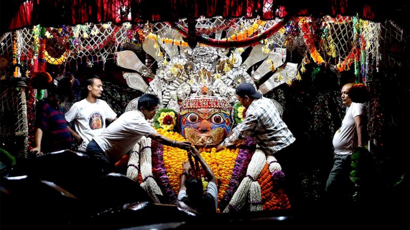  KATHMANDU -- Locals offer flower garlands to the idol of Aakash Bhairab in celebration of Indrajatra Festival in Kathmandu, Nepal, Sept. 16, 2019. The eight-day festival is to mark the end of the monsoon. Photo by Sunil Sharma/Xinhua/RSS.