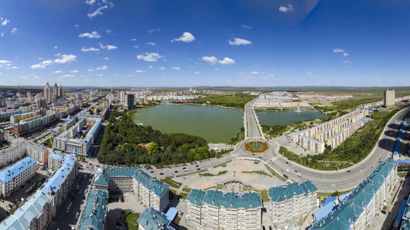 (190903) -- HULUNBUIR, Sept. 3, 2019 (Xinhua) -- Stitched aerial photo taken on Aug. 29, 2019 shows the view of the city of Manzhouli, north China's Inner Mongolia Autonomous Region. Located in the northeastern Inner Mongolia Autonomous Region, Hulunbuir, named after the Hulun Nur and Buir Nur, covers an area of about 253,000 square kilometers. It is home to more than 40 ethnic groups, including Han, Mongolian, Daur, Ewenki, Oroqen and Russian, etc. It boasts beautiful grasslands and vast forests, among which more than 500 lakes, over 3,000 rivers and large scale wetlands dot. The grassland, clear water, blue sky, white clouds, cattle and sheep have made Hulunbuir a famous tourist destination. (Xinhua/Shen Bohan)