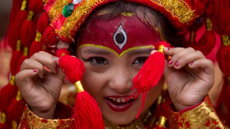 (190912) -- BEIJING, Sept. 12, 2019 (Xinhua) -- A girl dressed as living goddess Kumari reacts during the mass Kumari Puja on the occasion of Indrajatra Festival in Kathmandu, Nepal, Sept. 11, 2019. Over 50 girls attended the mass Kumari Puja for better health and prosperity. (Photo by Sulav Shrestha/Xinhua)