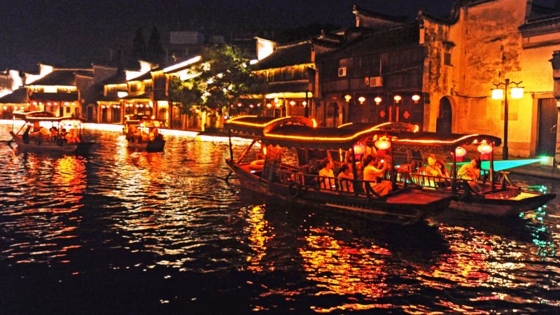 People enjoy the night view of an ancient river course on boat in Nanxun Town of Huzhou City, east China's Zhejiang Province, Sept. 11, 2019. Xinhua/RSS