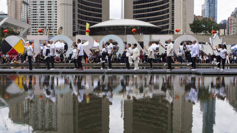 A group of Taiji enthusiasts practice Taiji during the Toronto Dragon Festival 2019 at the Nathan Phillips Square in Toronto, Canada, Sept. 7, 2019. The Toronto Dragon Festival 2019, which kicked off Friday at the Nathan Phillips Square in front of the Toronto City Hall, is catching the eyes of thousands of tourists and local residents. Partially funded and supported by the Government of Canada, the three-day 2019 Toronto Dragon Festival is hosted by the Canadian Association of Chinese Performing Arts. Photo/RSS