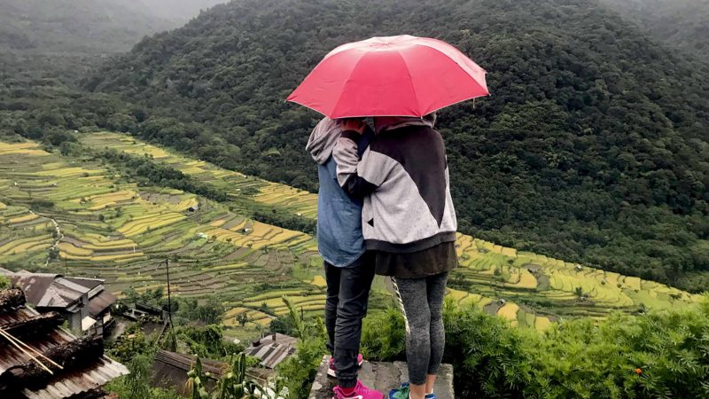 In this Sunday, Sept. 22, 2019, file photo, Naga girls hold an umbrella and look at rice fields from a vantage point in Khonoma village, in the northeastern Nagaland state, India. This historic village, home of Naga nationalism, has spearheaded conservation efforts in the state, working its way to becoming the first green village in India, putting a ban on felling of trees and hunting. AP/RSS