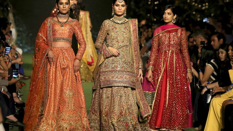 Models present creation by designer Fahad Hussayn during the Bridal Fashion Week organized by the Pakistan Fashion Design Council in Lahore, Pakistan, Saturday, Sept. 28, 2019. (AP Photo/K.M. Chaudary)