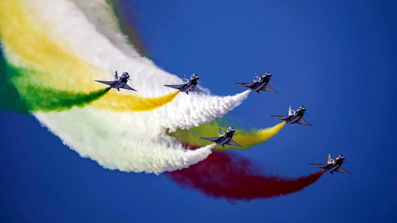 This photo taken on October 17, 2019 shows China's Bayi Aerobatic Team performing in the sky during the Chinese People's Liberation Army Air Force Aviation Open Day in Changchun in China's northeastern Jilin province, to mark the 70th anniversary of the founding of the Chinese People's Liberation Army Air Force. (Photo by STR / AFP) / China OUT