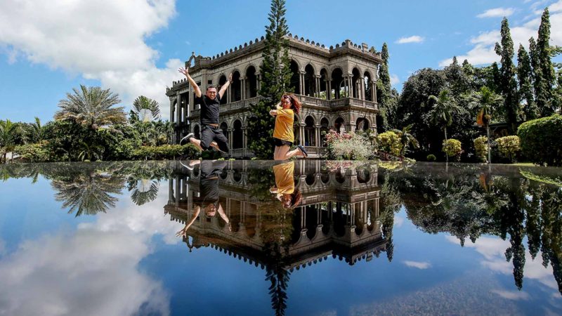 People pose for photo as they visit a tourist spot called The Ruins in Talisay City, the Philippines, Oct. 16, 2019. Xinhua/RSS