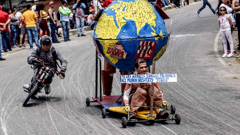 Participants descend a hill in home-made vehicles during the 30th Car Festival in Medellin, Antioquia department, Colombia, on November 17, 2019. (Photo by JOAQUIN SARMIENTO / AFP)