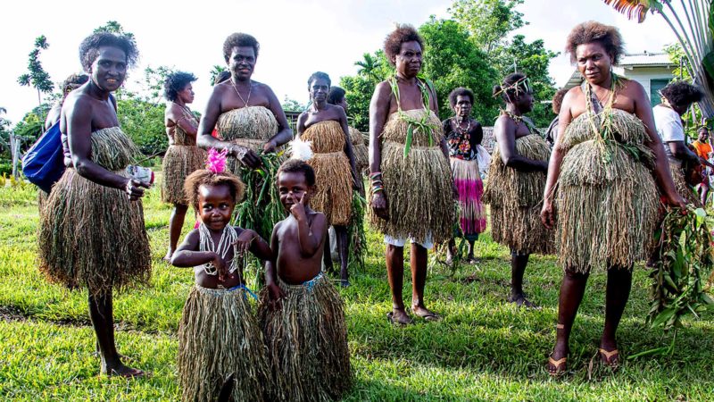 Women and children wear traditional dress as people queue to vote at a polling station in the capital Buka in an historical independence vote on November 25, 2019. - The resource-rich Pacific archipelago of Bougainville started a month-long landmark referendum on November 23, 2019 on independence from Papua New Guinea, a vote that could create the world's newest nation and prompt a dash for influence among regional powers. (Photo by NESS KERTON / AFP)