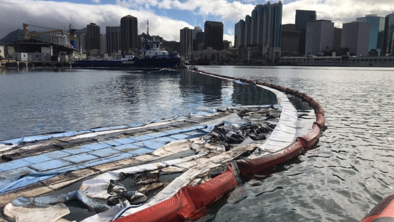 In this photo provided by the U.S. Coast Guard, their crews and other local agencies respond to an oil discharge from vessel Kamokuiki at Pier 19 in Honolulu, Thursday, Nov. 7, 2019. Two response vessels arrived on scene and deployed 1,600-feet of hard boom surrounding the 25 bales of absorbent material. Petty /RSS