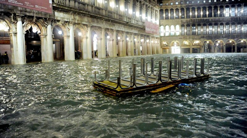 An overturned catwalk used as a walkway during high water floats in an over flooded St. Mark's Square late Tuesday, Nov. 12, 2019. The high-water mark hit 187 centimeters (74 inches) late Tuesday, meaning more than 85% of the city was flooded. The highest level ever recorded was 198 centimeters (78 inches) during infamous flooding in 1966. (Andrea Merola/ANSA via AP)