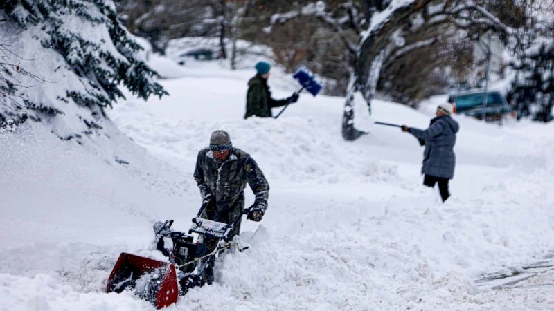 DENVER, CO - NOVEMBER 26: A trio digs out of the Green Mountain neighborhood on November 26, 2019 in Lakewood, Colorado. A blizzard warning was issued to residents for the Eastern Plains due to heavy snow accumulation on the roads and possible wind gusts up to 40 mph.   Joe Mahoney/Getty Images/AFP  == FOR NEWSPAPERS, INTERNET, TELCOS & TELEVISION USE ONLY ==