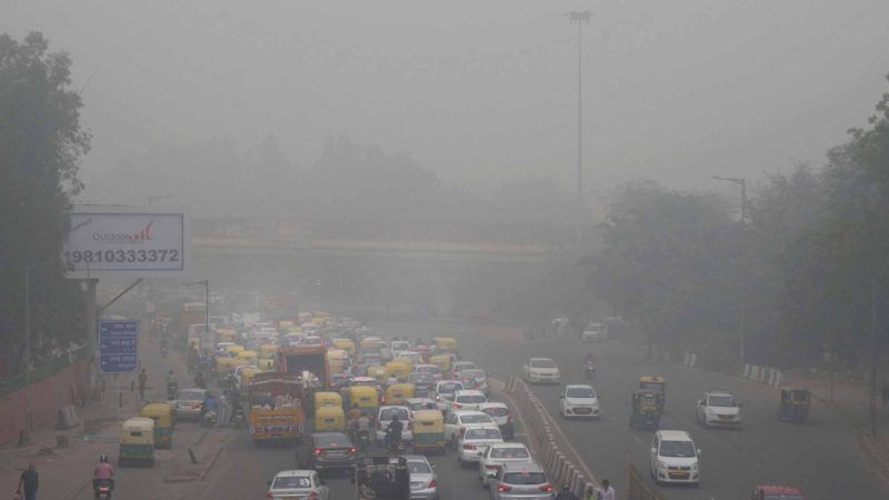 In this Sunday, Nov. 3, 2019, photo, vehicles wait for a signal at a crossing as the city enveloped in smog in New Delhi, India. Authorities in New Delhi are restricting the use of private vehicles on the roads under an "odd-even" scheme based on license plates to control vehicular pollution as the national capital continues to gasp under toxic smog. (AP Photo/Manish Swarup)