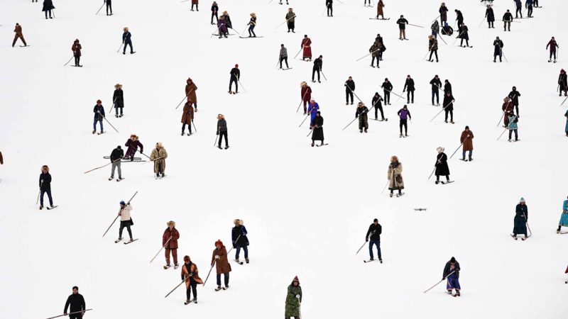 BEIJING -- Skiers take part in a carnival of the 14th Xinjiang Winter Tourism Trade Fair at a skiing field on Jiangjun Mountain in Altay, northwest China's Xinjiang Uygur Autonomous Region, Nov. 27, 2019. Xinhua/Sadat