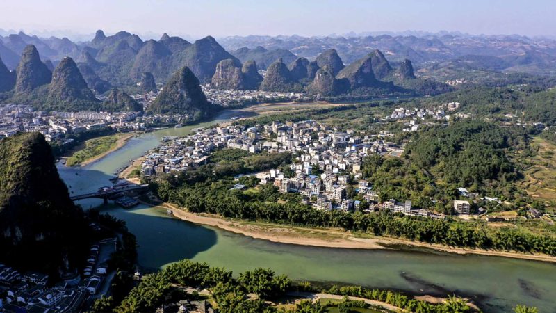 YANGSHUO-- Aerial photo taken on Nov. 14, 2019 shows the scenery of Yangshuo County, Guilin City, south China's Guangxi Zhuang Autonomous Region. Xinhua/RSS.