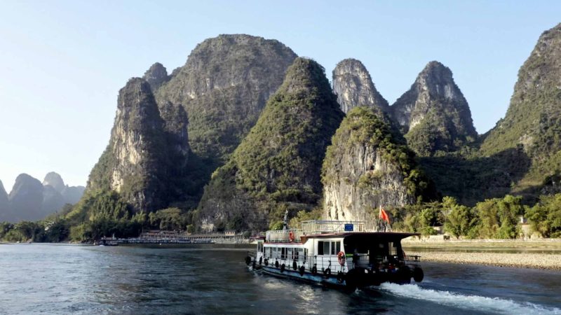 YANGSHUO -- Photo taken on Nov. 19, 2019 shows a cruise ship on the Lijiang River in Guilin, south China's Guangxi Zhuang Autonomous Region. (Xinhua/Cao Yiming)
