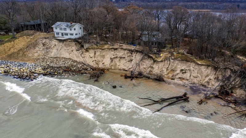 Erosion reaches a house along Lake Michigan's southwestern shoreline on Wednesday, Dec. 4, 2019, in Stevensville, Mich. (Robert Franklin/South Bend Tribune via AP)