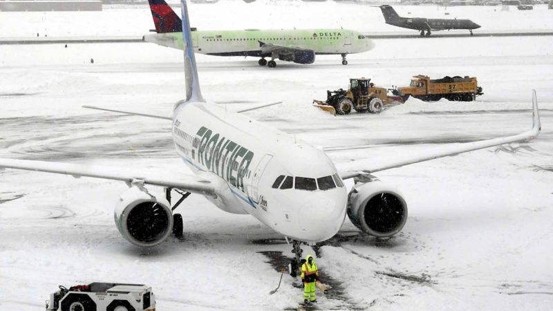 Ground crews remove snow from the airport tarmac as flights resume after an overnight snowfall, at the Albany International Airport in Colonie, N.Y., on Monday, Dec. 2, 2019. (AP Photo/Hans Pennink)