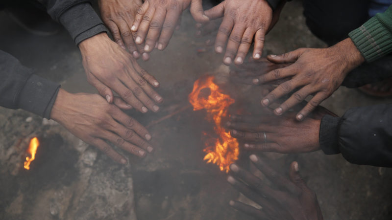 People warm their hands around a bonfire in Lucknow, India, Sunday, Dec. 29, 2019. Northern India is experiencing extreme cold conditions. AP Photo/RSS