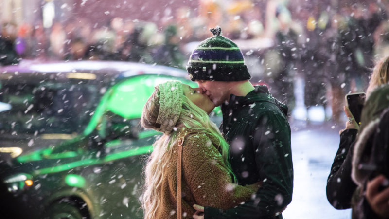 Lovers kiss at Times Square in New York, the United States, Dec. 18, 2019. A sudden snow squall hit New York on Wednesday. Xinhua/RSS