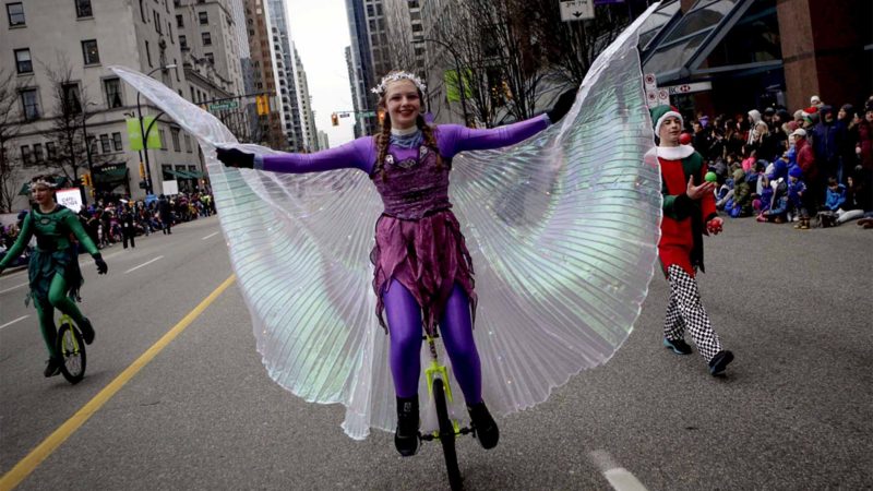 (VANCOUVER -- A costumed performer rides a unicycle during the Santa Claus Parade in Vancouver, Canada, on Dec. 1, 2019. An annual Santa Claus Parade was held in Vancouver on Sunday, attracting about 300,000 spectators. Xinhua/RSS.