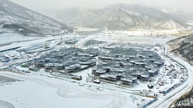 (191218) -- CHONGLI, Dec. 18, 2019 (Xinhua) -- An aerial photo taken with a drone on Dec. 10, 2019 shows the Taizicheng Railway Station (L) on the Beijing-Zhangjiakou High-speed Railway in Chongli, north China's Hebei Province. Chongli, a district of Zhangjiakou in Hebei Province which is 200 kilometers northwest of Chinese capital Beijing, has become a popular skiing destination as it will host most of the skiing events at the 2022 Winter Olympic Games. (Xinhua/Yang Shiyao)