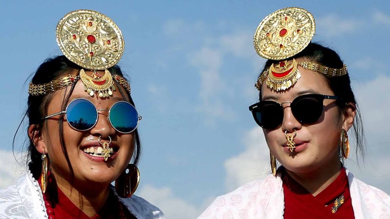 BEIJING -- Girls from Kirat community with traditional costume and ornaments smile during the celebration of Udhauli festival in Kathmandu, Nepal, Dec. 14, 2019. Udhauli is the annual festival celebrated by Kirat communities of eastern Nepal, marking the migration of animals and birds to low altitude towards warmer regions as the winter season arrives. (Photo by Sunil Sharma/Xinhua)
