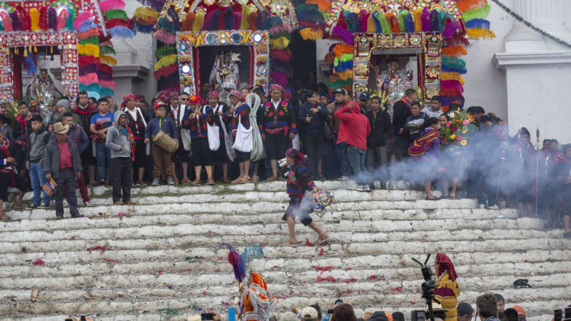 An indigenous spiritual guide dances during a celebration honoring Saint Thomas, the patron saint of Chichicastenango, Guatemala, Saturday, Dec. 21, 2019. After eight uninterrupted days of celebration in honor of their patron Saint Thomas, fireworks accompany three bands that play simultaneously at the corners of one of the most emblematic markets in Guatemala. AP Photo/RSS