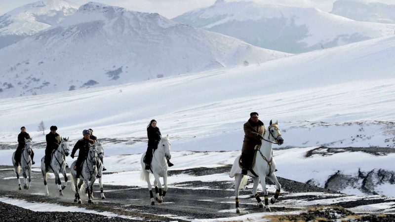 This undated photo provided on Wednesday, Dec. 4, 2019, by the North Korean government shows North Korean leader Kim Jong Un, right, and his wife Ri Sol Ju, second from right, riding on white horse during a visit to Mount Paektu, North Korea. North Korea says leader Kim has taken a second ride on a white horse to a sacred mountain in less than two months. Independent journalists were not given access to cover the event depicted in this image distributed by the North Korean government. The content of this image is as provided and cannot be independently verified. Korean language watermark on image as provided by source reads: "KCNA" which is the abbreviation for Korean Central News Agency. (Korean Central News Agency/Korea News Service via AP)