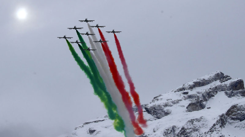 The Frecce Tricolore Italian Air Force acrobatic squad flies during an alpine ski, men's World Cup giant slalom, in Alta Badia, Italy, Sunday, Dec. 22, 2019. AP Photo/RSS