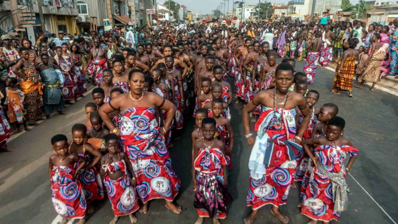 Voodoo devotees parades on the main boulevard of Porto-novo in Benin on January 11, 2020. - The 4th edition of the Porto Novo International Festival (FIP) takes place from January 4 to 12, 2020 in Porto-Novo. 1,200 cultural and ritual masks from several African countries paraded for a grand parade during the 4th edition of the International Festival of Culture, Arts and Vodun Civilization scheduled to date in Porto-Novo. (Photo by Yanick Folly / AFP)