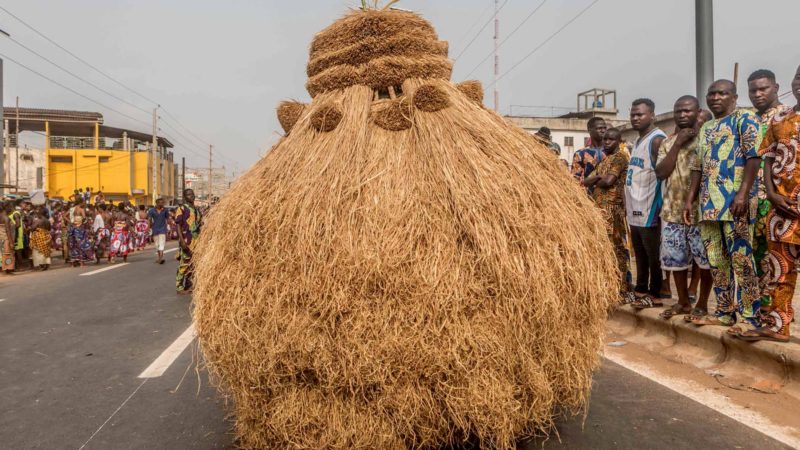 Voodoo devotees dressed in costume parade on the main boulevard of Porto-novo, in Benin on January 11, 2020. - The 4th edition of the Porto Novo International Festival (FIP) takes place from January 4 to 12, 2020 in Porto-Novo. 1,200 cultural and ritual masks from several African countries paraded for a grand parade during the 4th edition of the International Festival of Culture, Arts and Vodun Civilization scheduled to date in Porto-Novo. (Photo by Yanick Folly / AFP)