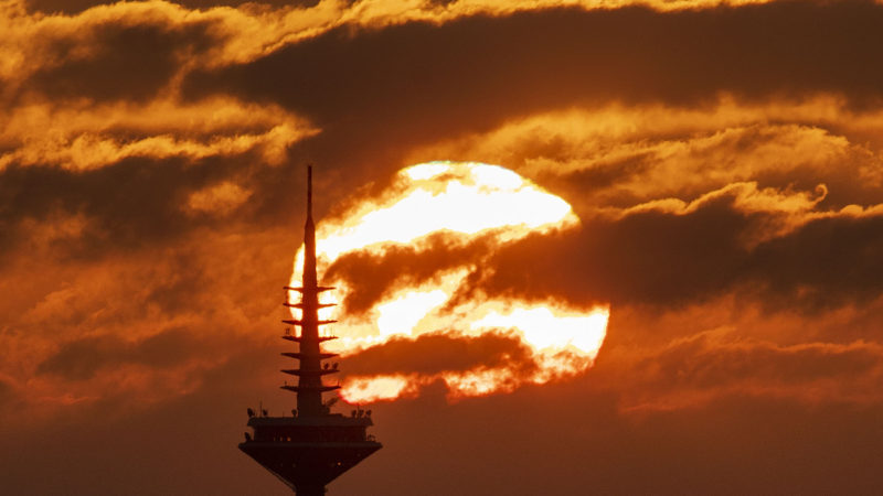 The sun rises behind the television tower in Frankfurt, Germany, Wednesday, Feb. 5, 2020. AP Photo/RSS