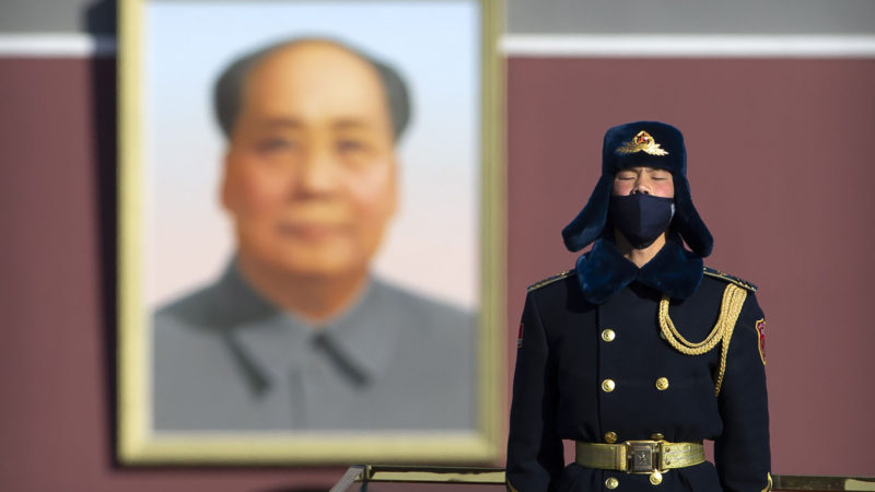 A member of a Chinese honor guard wears a face mask as he stands guard on Tiananmen Square in Beijing, Tuesday, Feb. 4, 2020. China said Tuesday the number of infections from a new virus surpassed 20,000 as medical workers and patients arrived at a new hospital and President Xi Jinping said "we have launched a people's war of prevention of the epidemic." AP Photo/RSS