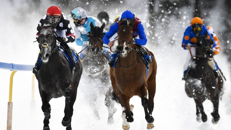 Lukas Delozier on Iron Duke, left, rides to win the "Gp Moyglare Stud" on a frozen Lake on the third weekend of the White Turf races in St. Moritz, Switzerland, Sunday, Feb 16, 2020. Photo/RSS